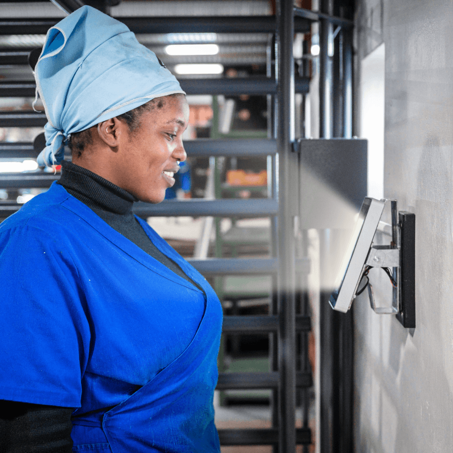 worker clocking in with facial scanning